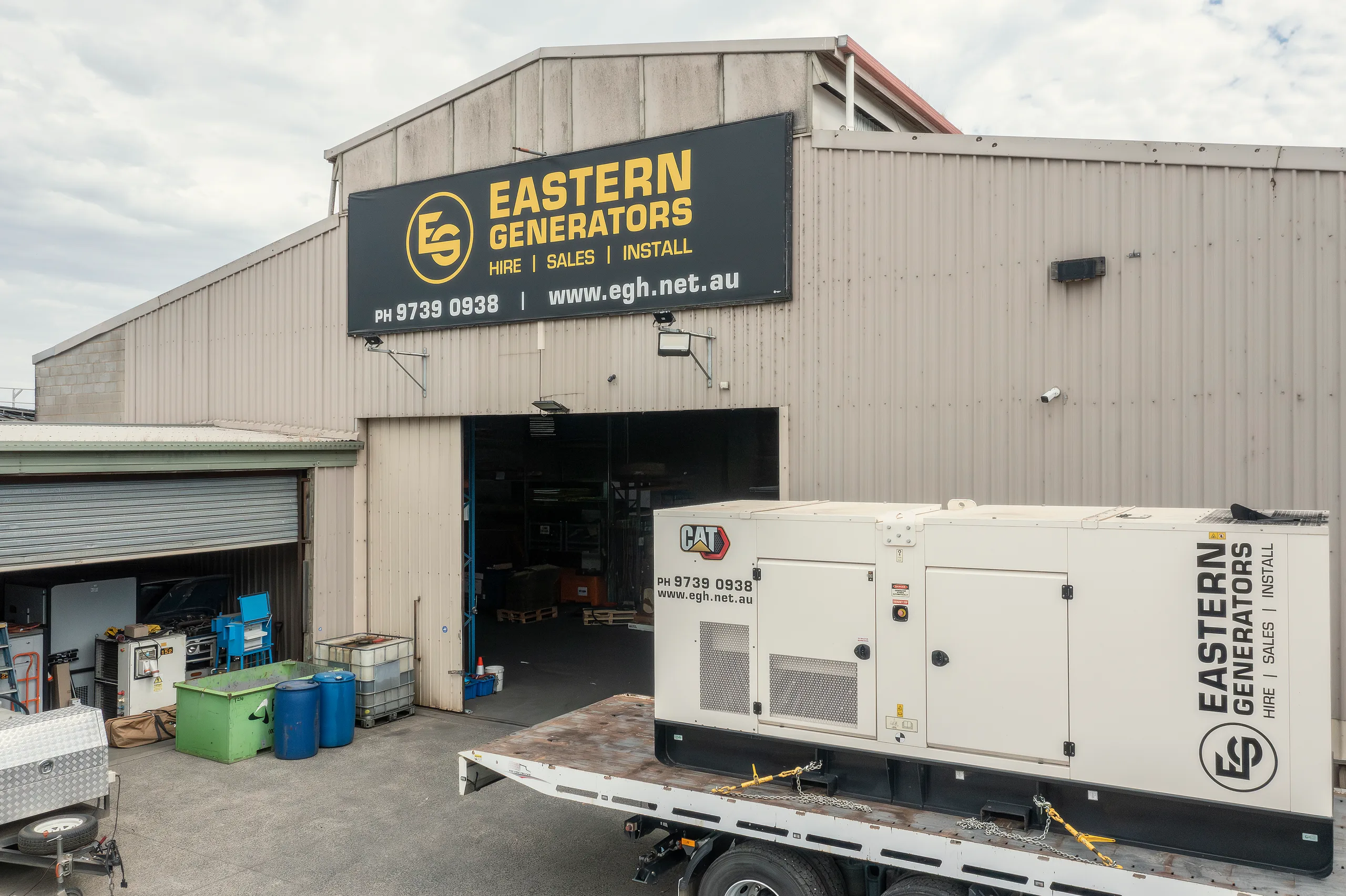 A canopied Caterpillar generator on a trailer outside the Eastern Generators depot in Kilsyth