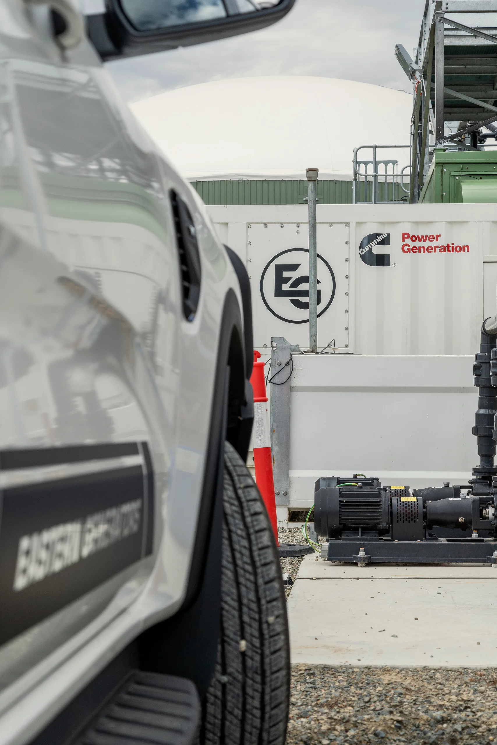 An Eastern Generators technician running services to a containerised set on site