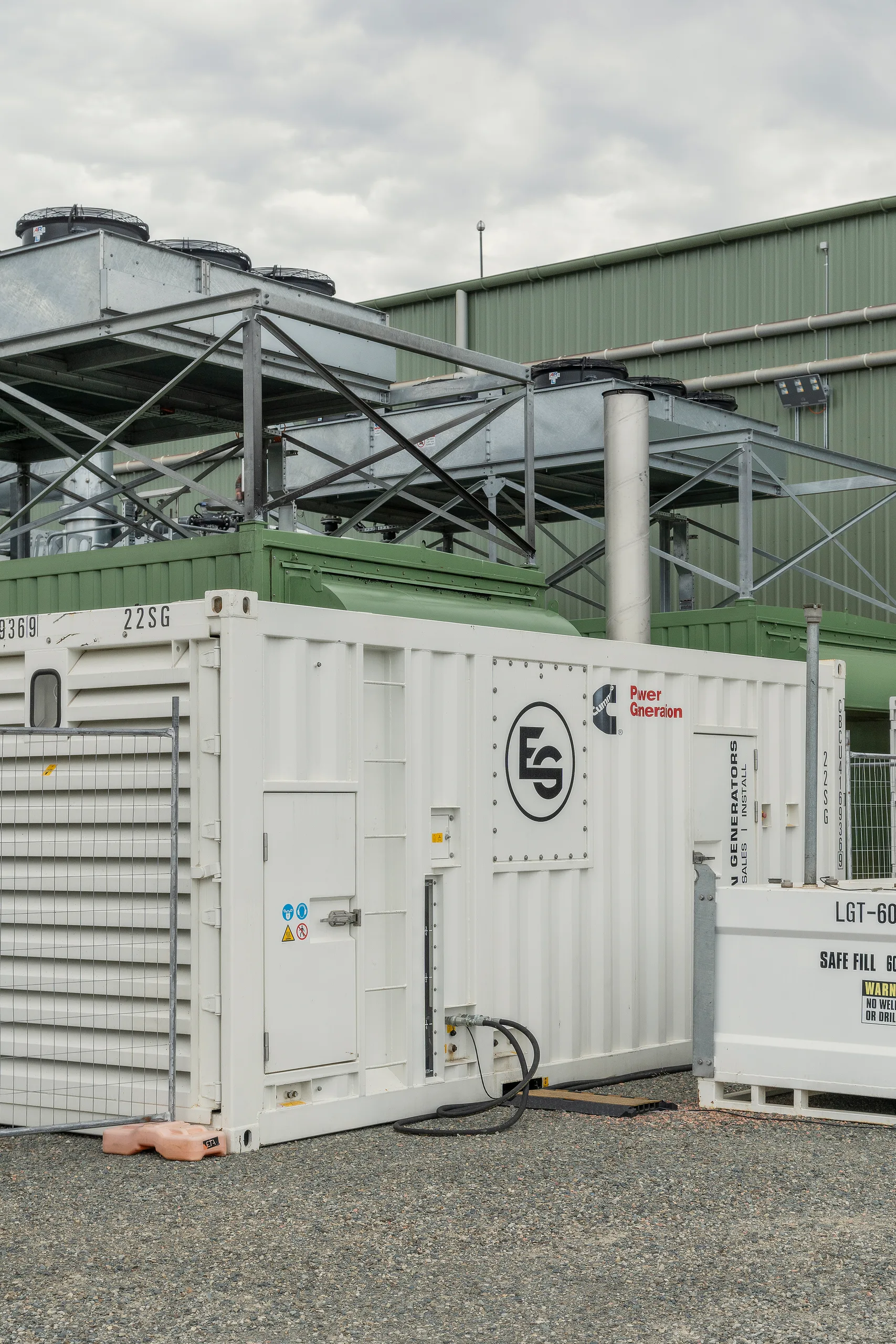 A containerised power generation unit installed on an industrial site