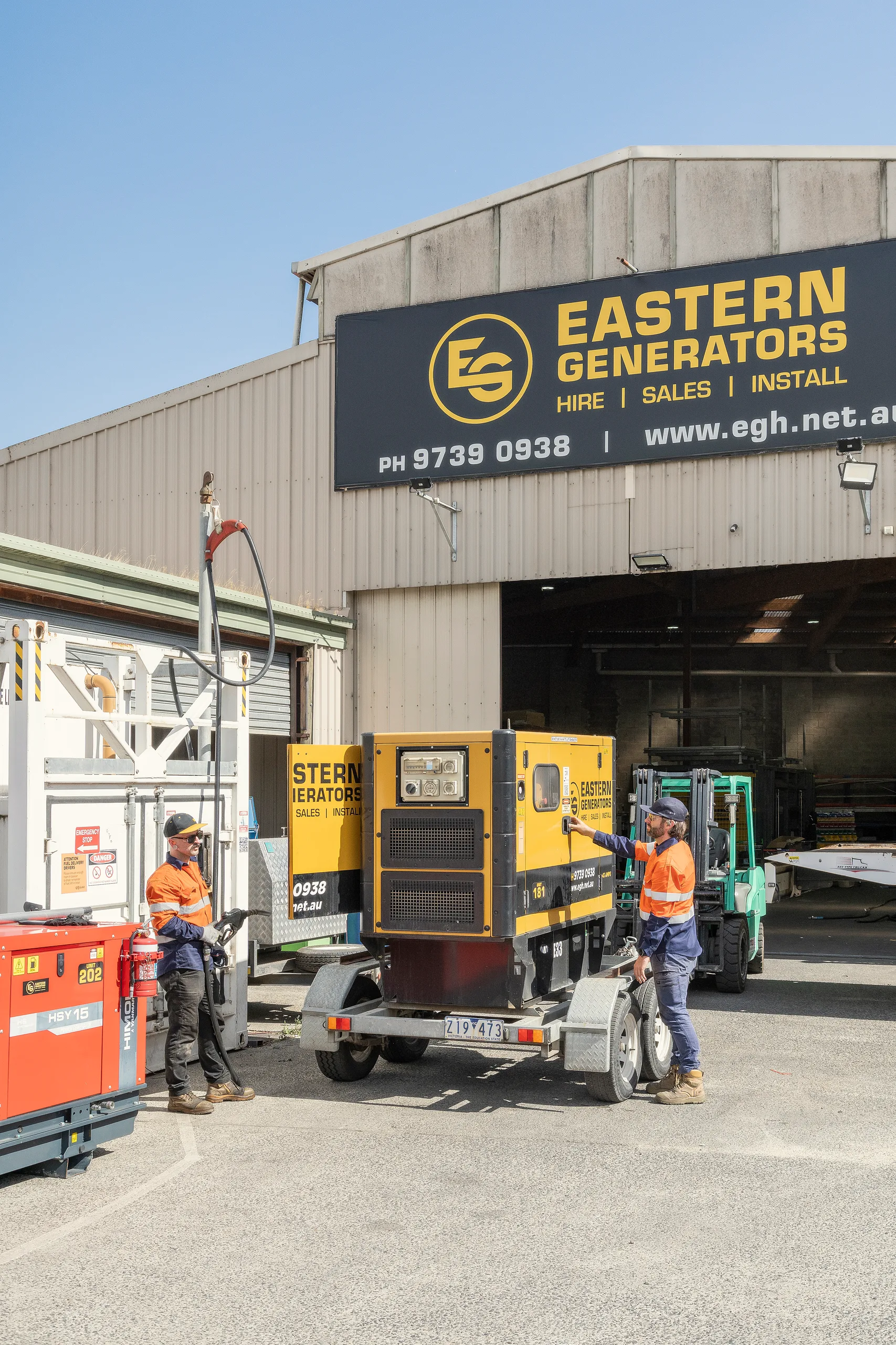 Eastern Generators crew moving a small hire set in the Kilsyth yard