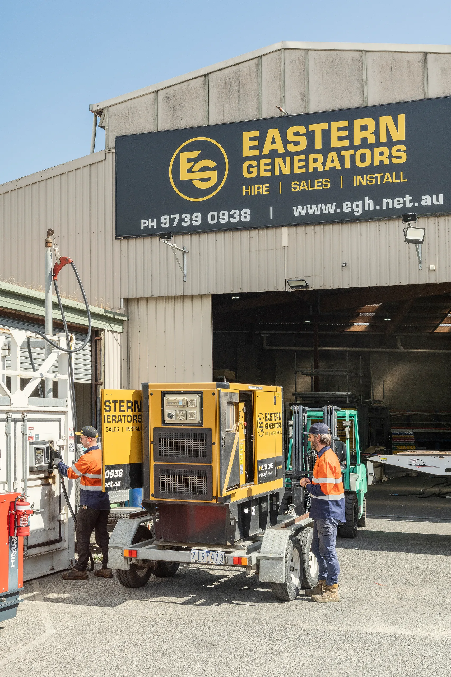 Eastern Generators crew loading a canopied hire set at the Kilsyth depot