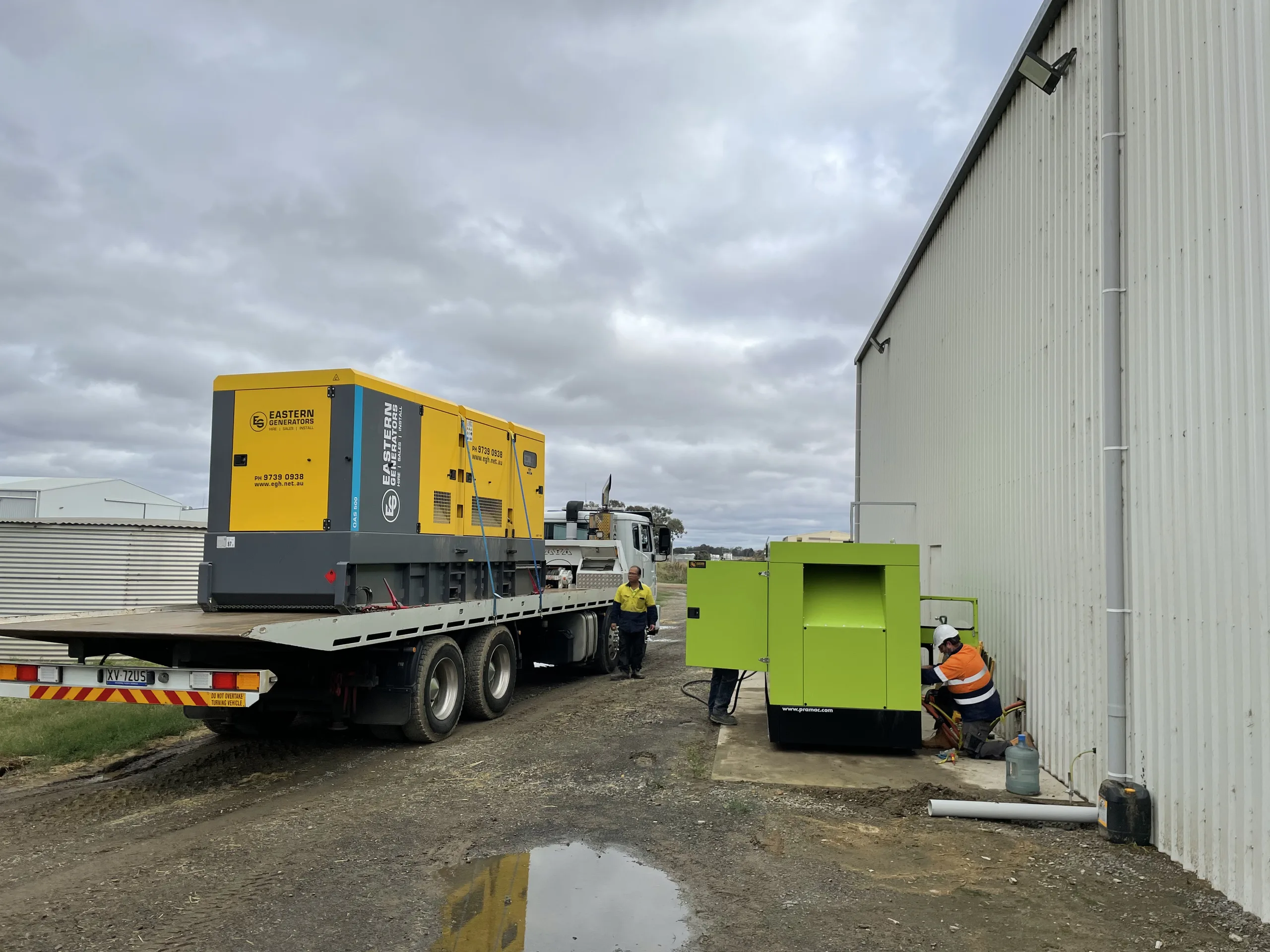 A large hire generator being carried on a semi trailer