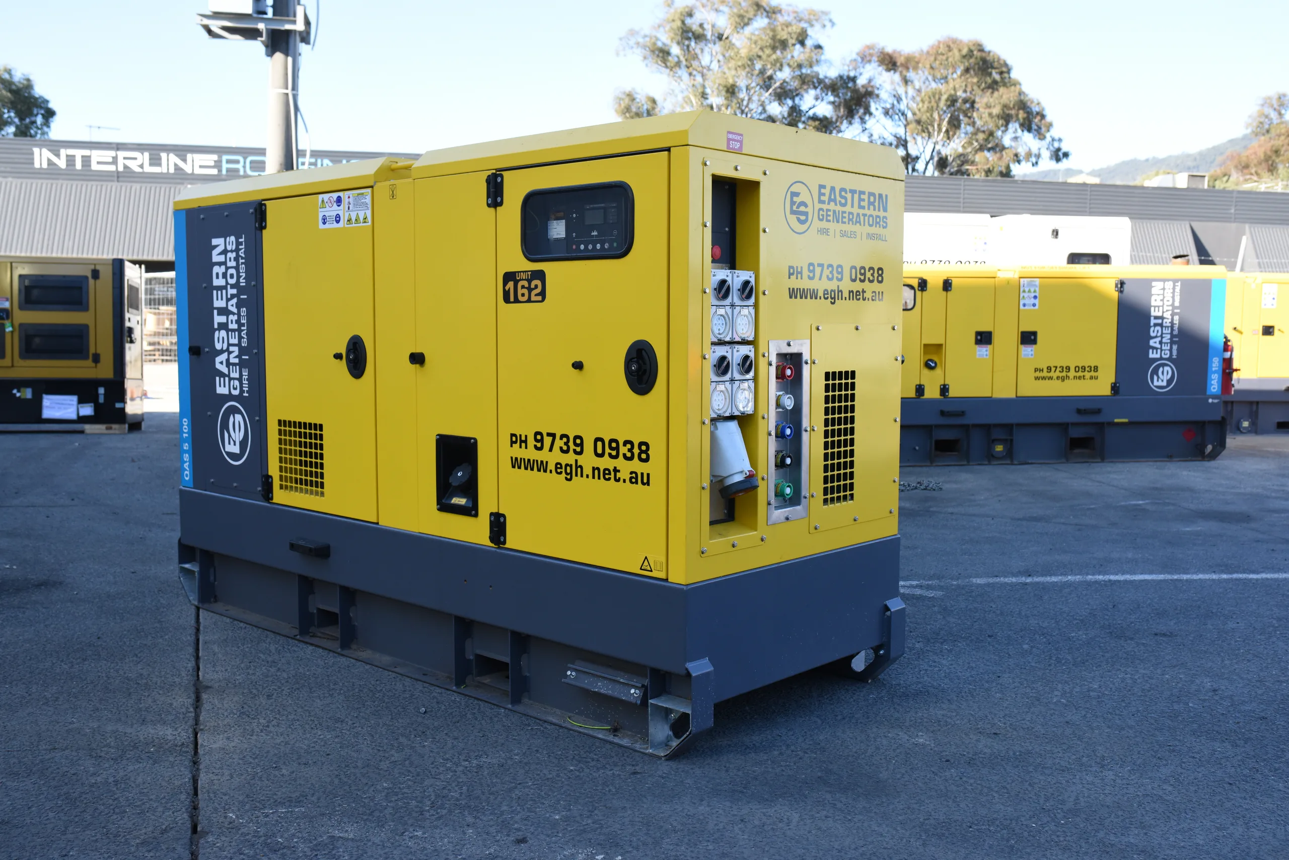 The outlet panel on an Eastern Generators hire set, with single and three-phase sockets